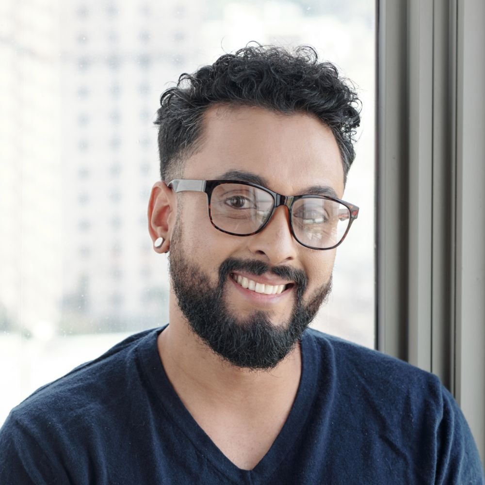 Testimonials handsome smiling man in glasses 5yveydz 1 1.jpg